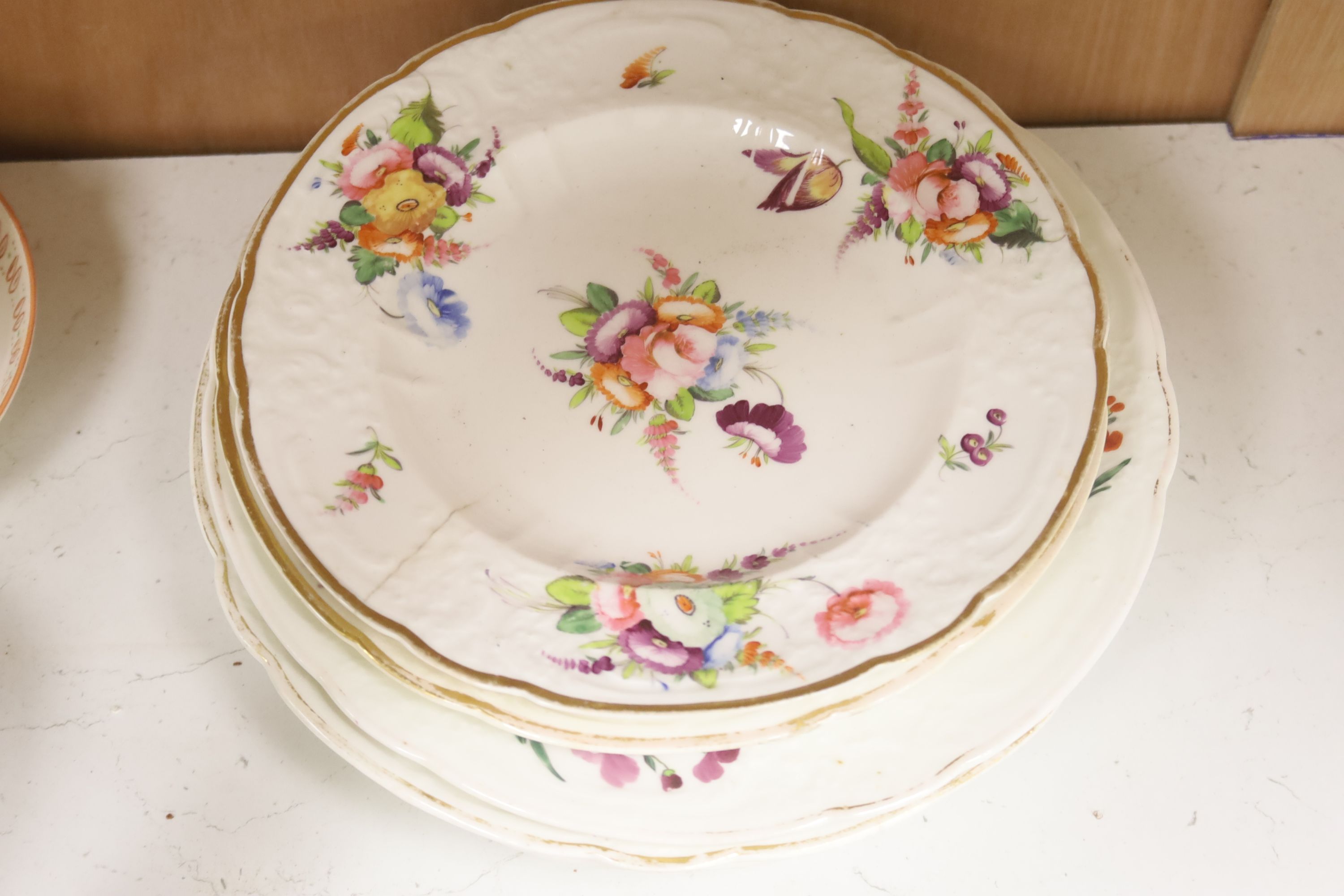 A group of late 18th / early 19th century English porcelain teaware and plates